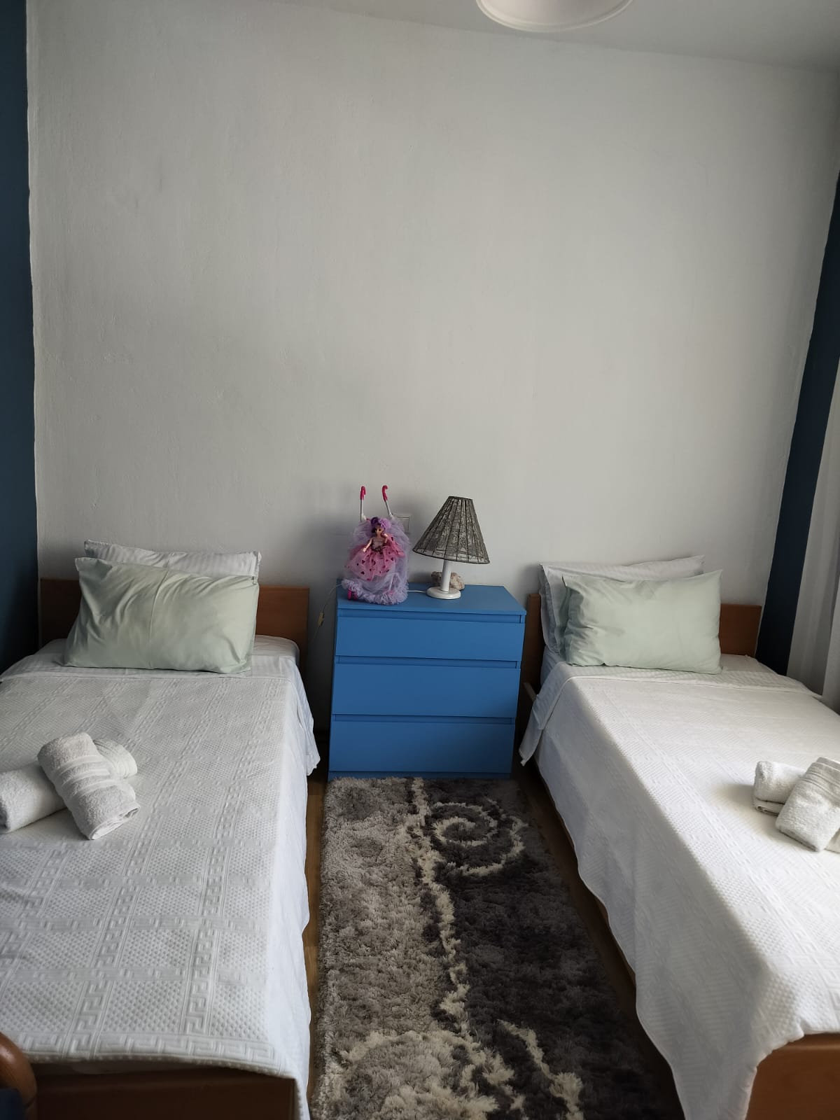 Twin bedroom with fresh linens at Porto Germeno Villa