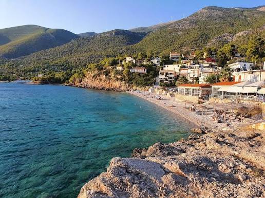 Waterfront tavernas and boats along the shore at Porto Germeno